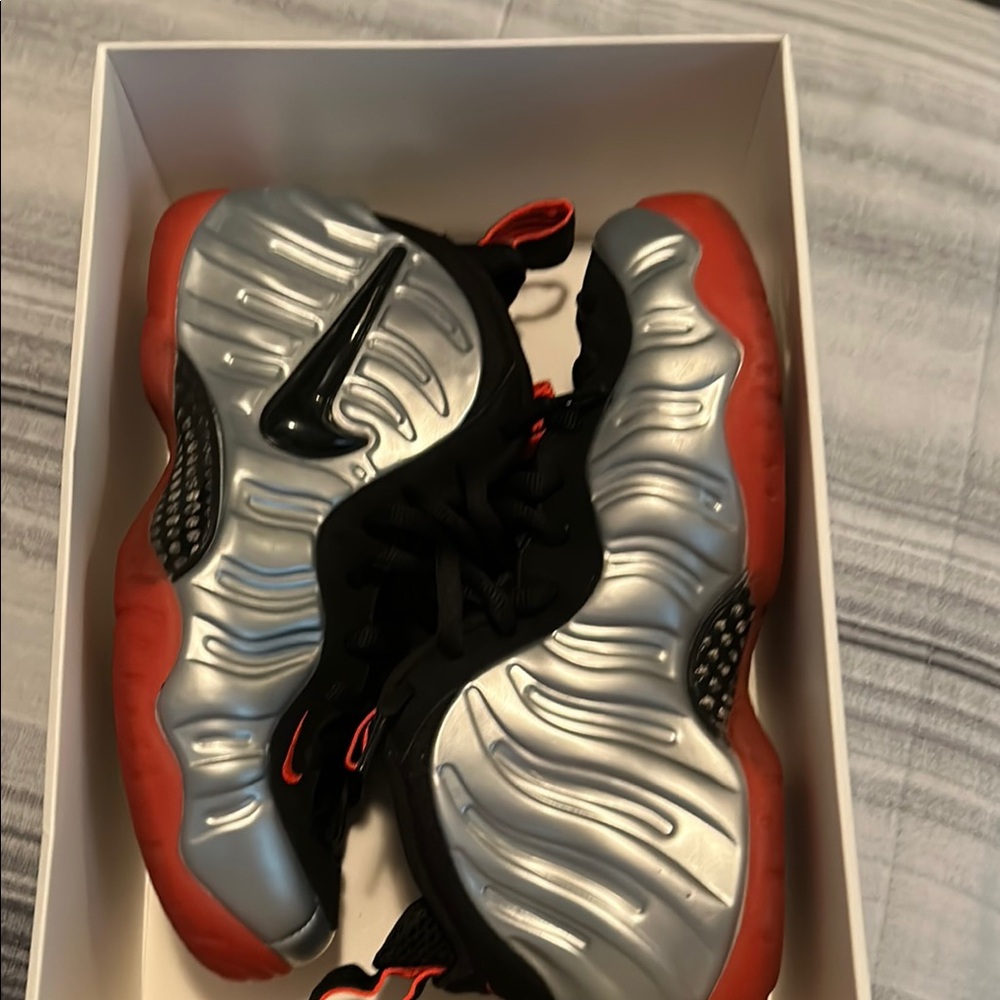 Nike Silver and Red Foamposite Sneakers